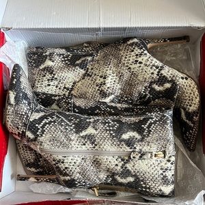 Over the knee snake boots